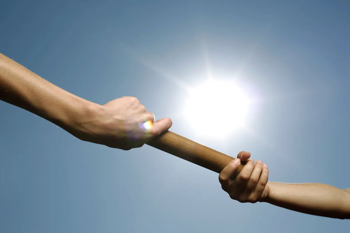 Relay baton exchange against the sun